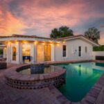 Sunset over a waterfront pool home in Largo, Florida
