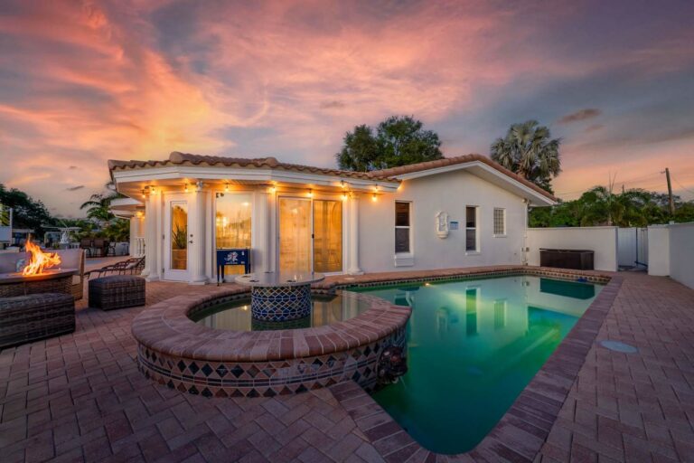 Sunset over a waterfront pool home in Largo, Florida