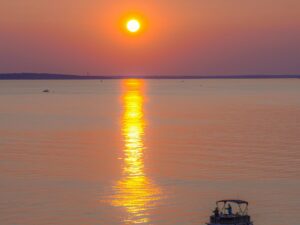 Boat cruising on Tampa Bay at sunset
