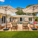 Courtyard with the pool and loungers at On the Creek